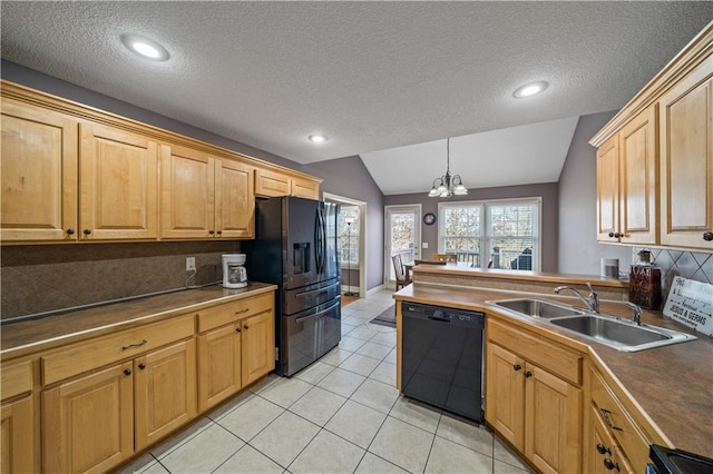 kitchen with sink, tasteful backsplash, decorative light fixtures, vaulted ceiling, and black appliances