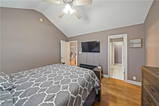 bedroom featuring lofted ceiling, hardwood / wood-style floors, and ceiling fan