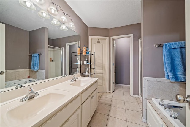 bathroom featuring tile patterned flooring, vanity, and plus walk in shower