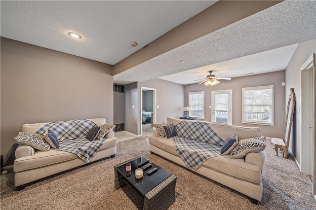 living room featuring carpet flooring and a textured ceiling