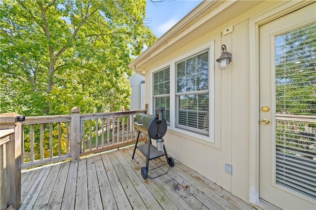 wooden deck featuring area for grilling