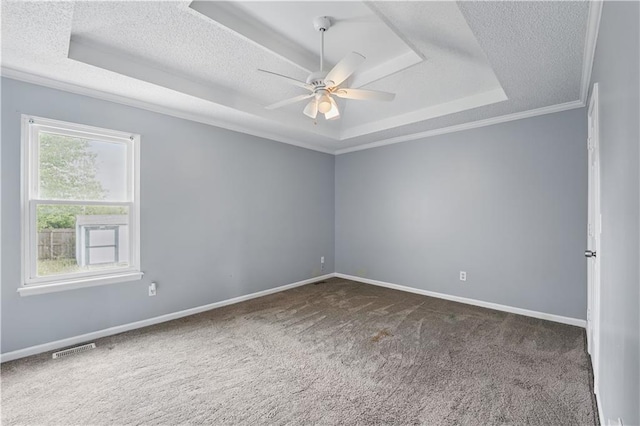 2016 NE Summerfield Ct, Blue Springs, MO 64029 - spare room with a raised ceiling, a textured ceiling, a ceiling fan, carpet flooring, and ornamental molding
