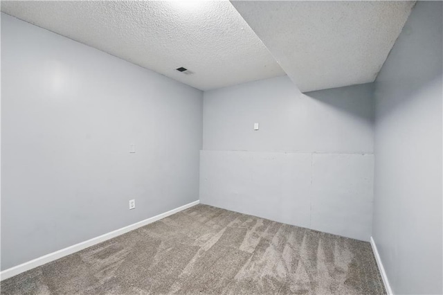 2016 NE Summerfield Ct, Blue Springs, MO 64029 - carpeted spare room featuring a textured ceiling and baseboards