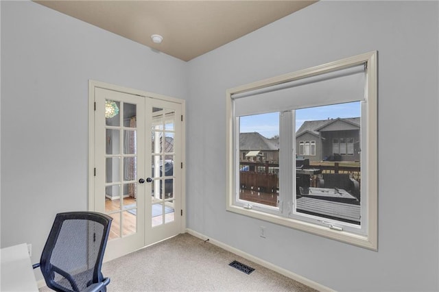 office featuring carpet floors, french doors, visible vents, and baseboards