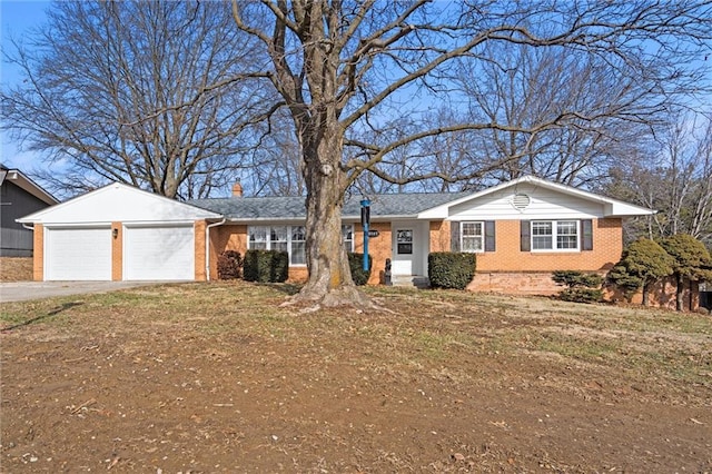 ranch-style house with a garage and a front yard