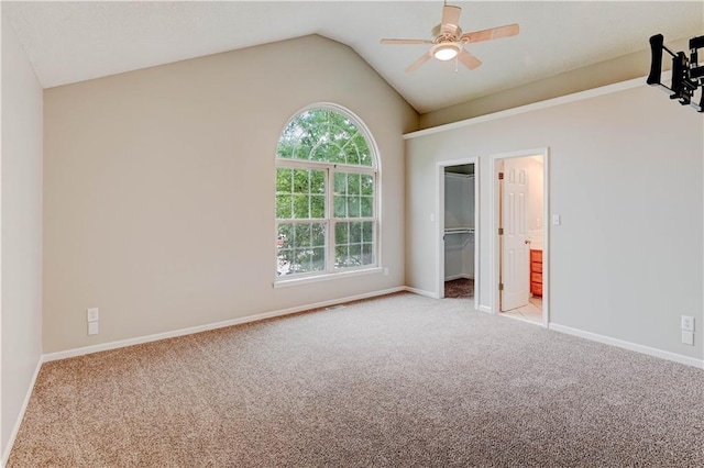 828 SW Harvest Dr, Grain Valley, MO 64029 - unfurnished bedroom with carpet flooring, vaulted ceiling, multiple windows, a spacious closet, and baseboards