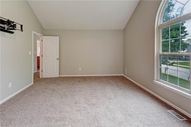 828 SW Harvest Dr, Grain Valley, MO 64029 - carpeted spare room with vaulted ceiling and baseboards