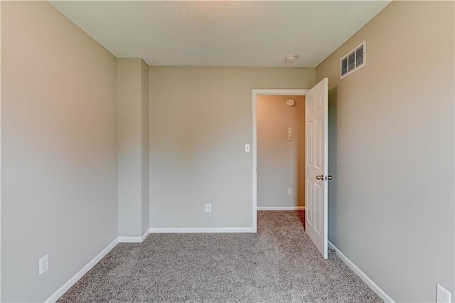 828 SW Harvest Dr, Grain Valley, MO 64029 - unfurnished room with carpet flooring, a smoke detector, a textured ceiling, and baseboards