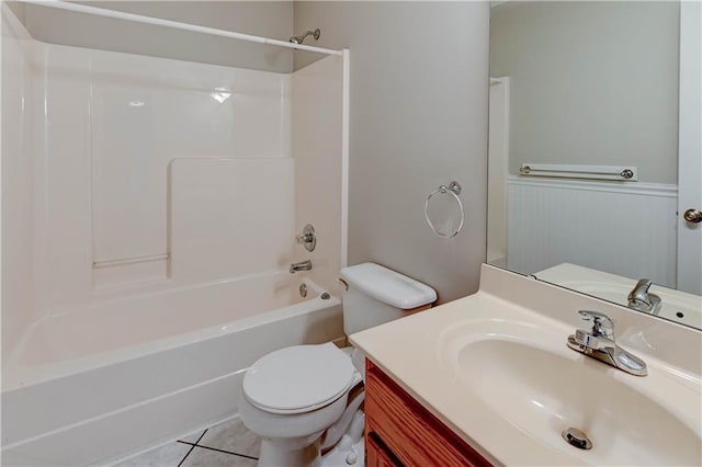 828 SW Harvest Dr, Grain Valley, MO 64029 - full bathroom featuring shower / tub combination, toilet, vanity, tile patterned flooring, and wainscoting