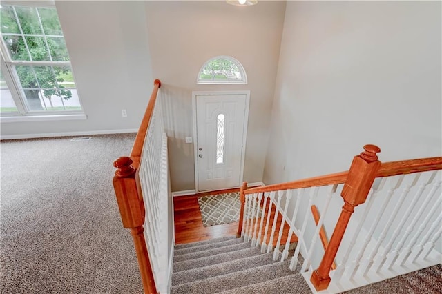 828 SW Harvest Dr, Grain Valley, MO 64029 - carpeted foyer featuring baseboards