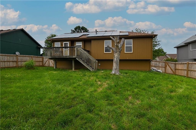 828 SW Harvest Dr, Grain Valley, MO 64029 - back of house featuring stairs, a deck, and roof mounted solar panels
