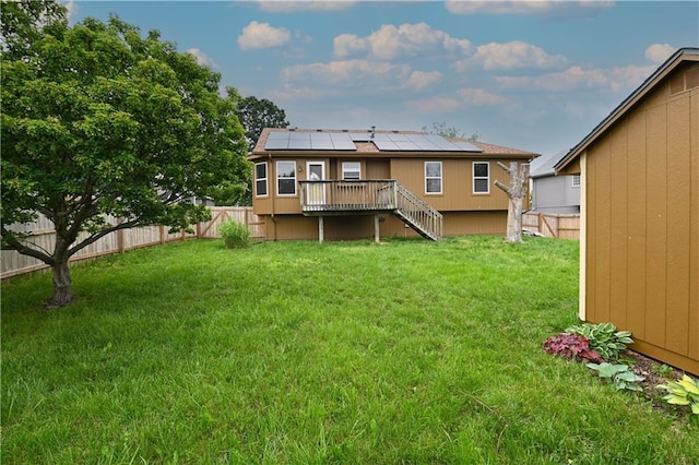 828 SW Harvest Dr, Grain Valley, MO 64029 - back of house with a deck, stairway, and solar panels
