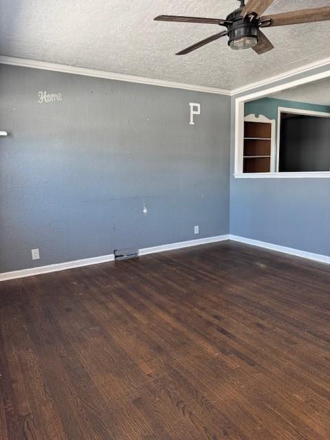 spare room featuring ceiling fan, crown molding, dark hardwood / wood-style floors, and a textured ceiling