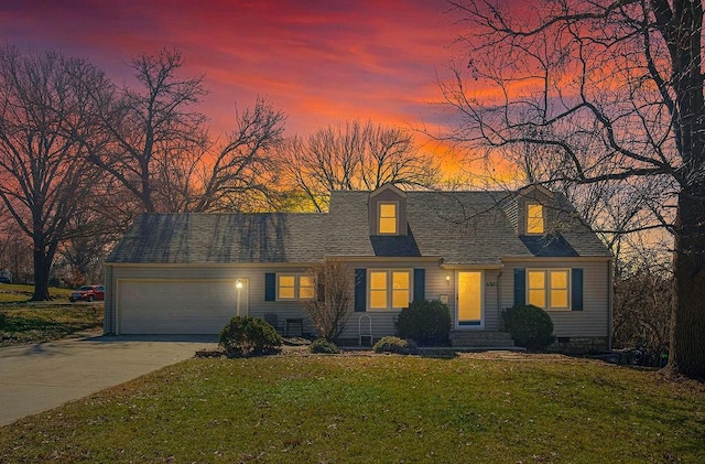 cape cod-style house featuring a garage, driveway, a front lawn, roof with shingles, and crawl space