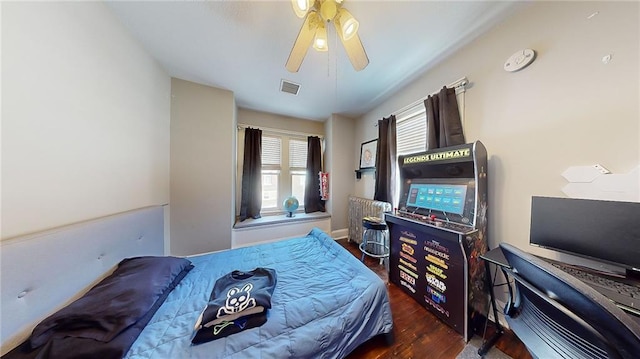 bedroom featuring dark hardwood / wood-style flooring and ceiling fan