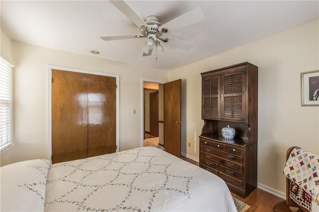 bedroom featuring hardwood / wood-style flooring and ceiling fan