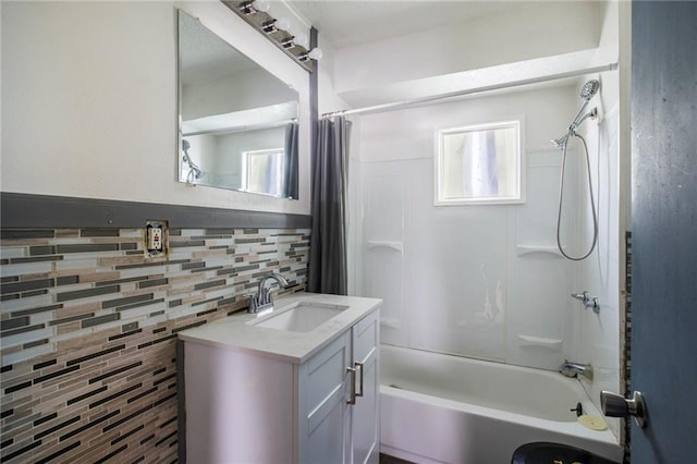 bathroom with vanity, shower / tub combo, and decorative backsplash