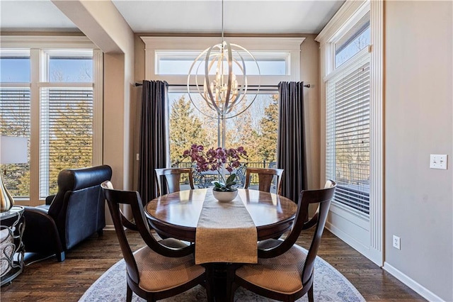 dining space featuring a chandelier and dark hardwood / wood-style flooring