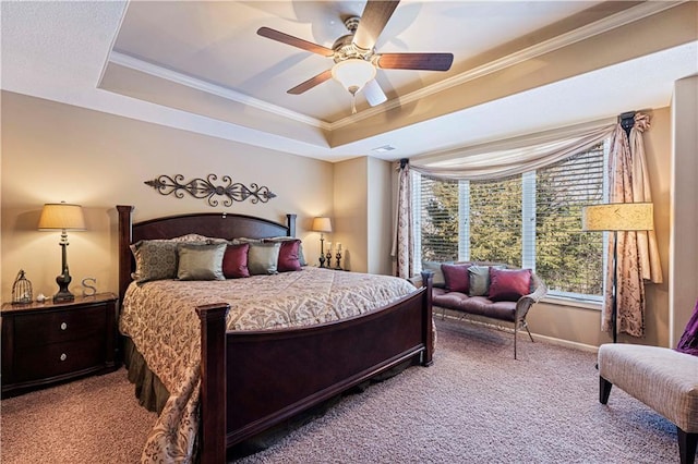 carpeted bedroom with crown molding, a raised ceiling, and ceiling fan