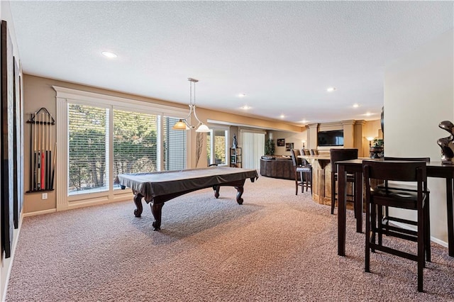 recreation room with billiards, a textured ceiling, and carpet flooring