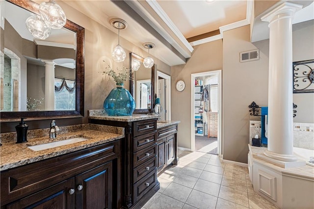 bathroom featuring ornate columns, ornamental molding, vanity, tile patterned flooring, and a washtub