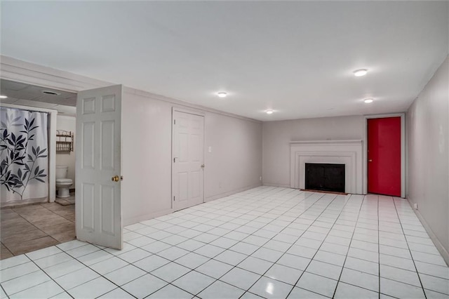 unfurnished living room featuring light tile patterned floors