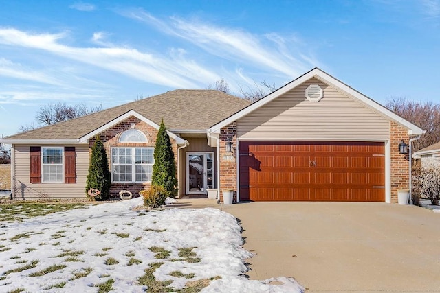 ranch-style home featuring a garage