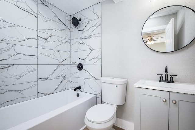 full bathroom featuring vanity, toilet, and tiled shower / bath combo