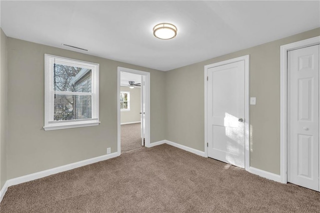 unfurnished bedroom featuring carpet flooring