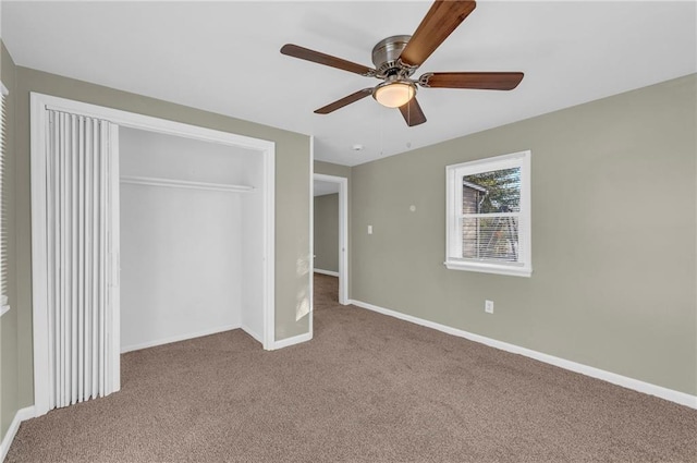 unfurnished bedroom with ceiling fan, light colored carpet, and a closet