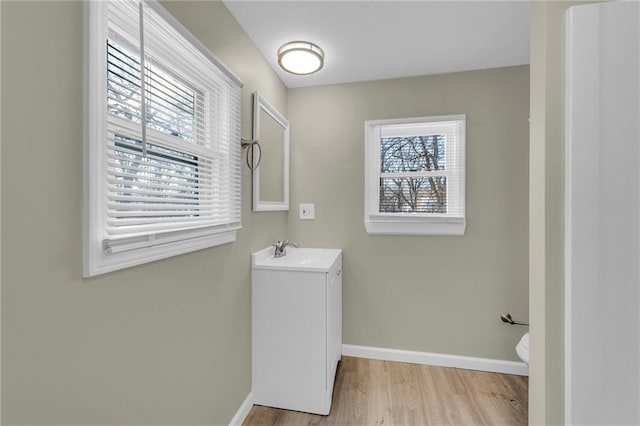 bathroom featuring vanity, toilet, and wood-type flooring