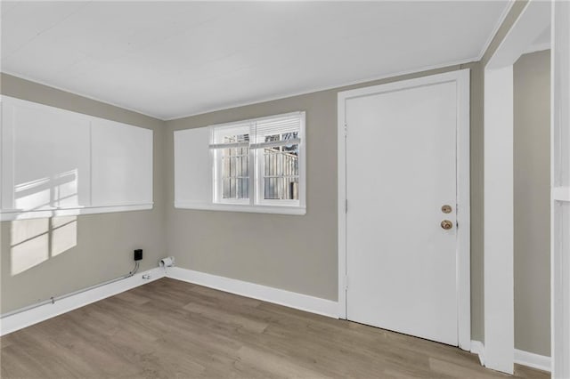 laundry room featuring light wood-type flooring