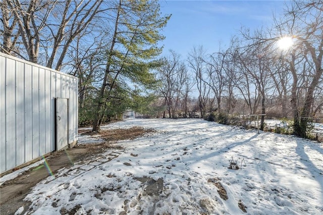 view of yard layered in snow