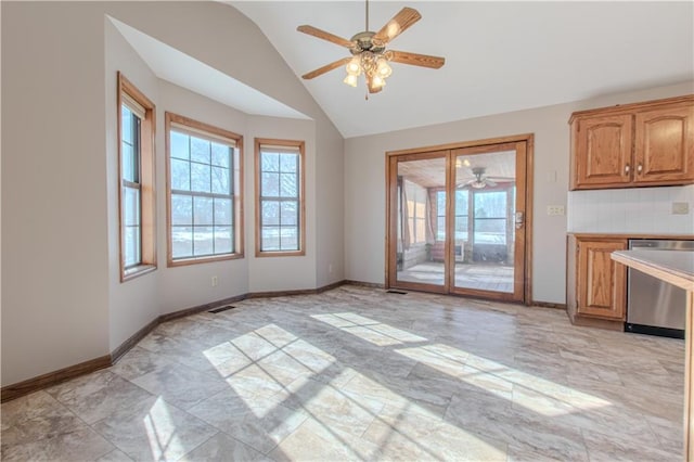 unfurnished dining area featuring vaulted ceiling and ceiling fan