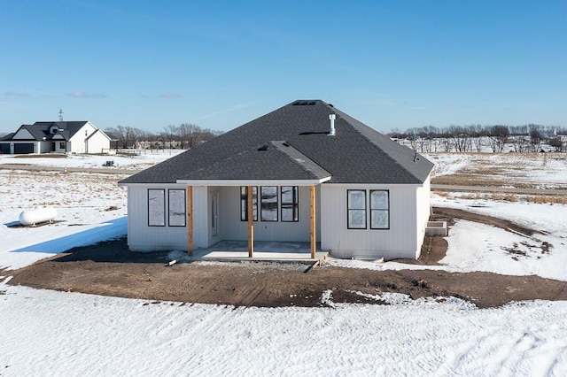 view of front of home with a shingled roof