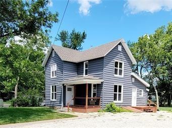 traditional-style house with a front lawn