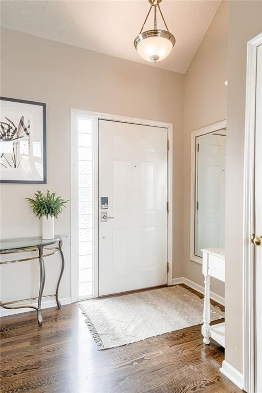 foyer entrance with hardwood / wood-style flooring