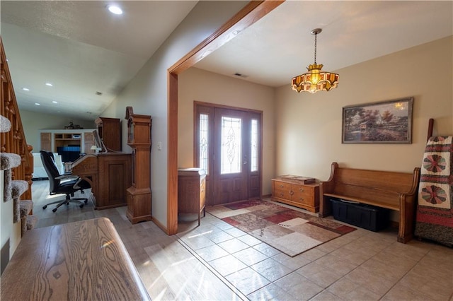 foyer entrance with vaulted ceiling