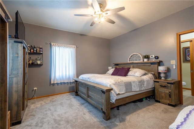 bedroom featuring light carpet and ceiling fan