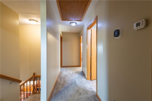 hallway featuring light carpet