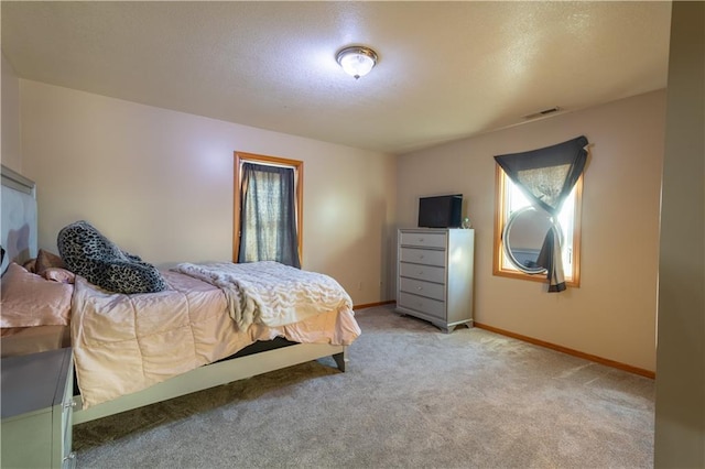 bedroom featuring light colored carpet