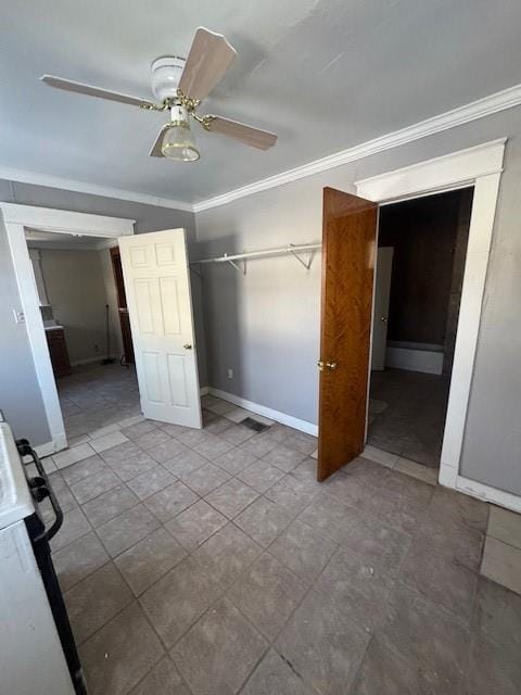 unfurnished bedroom featuring ornamental molding and ceiling fan