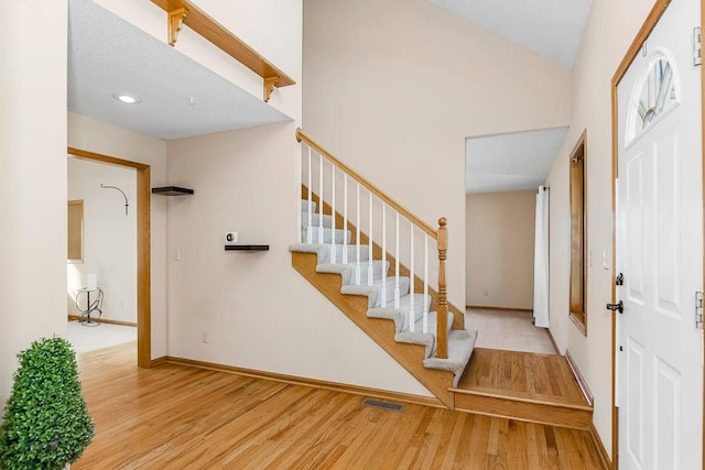 foyer entrance with light hardwood / wood-style flooring