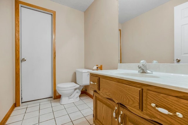 bathroom featuring vanity, toilet, and tile patterned floors