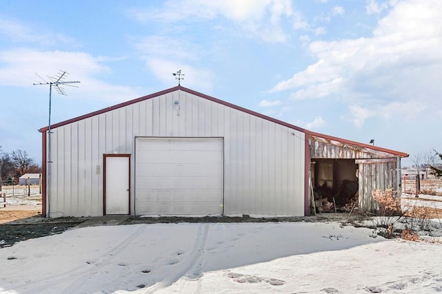 view of snow covered garage