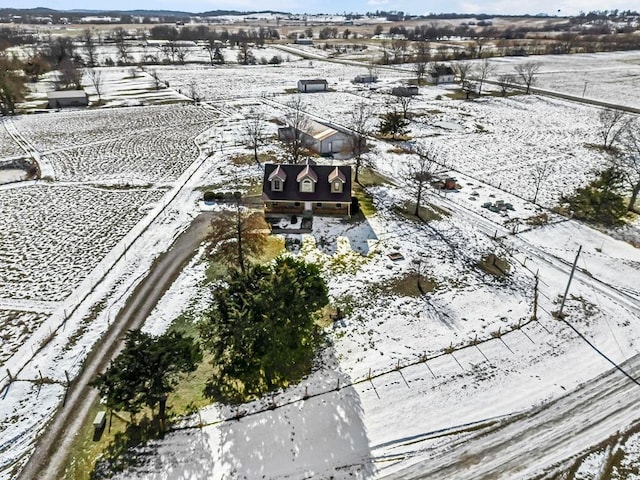 snowy aerial view featuring a rural view