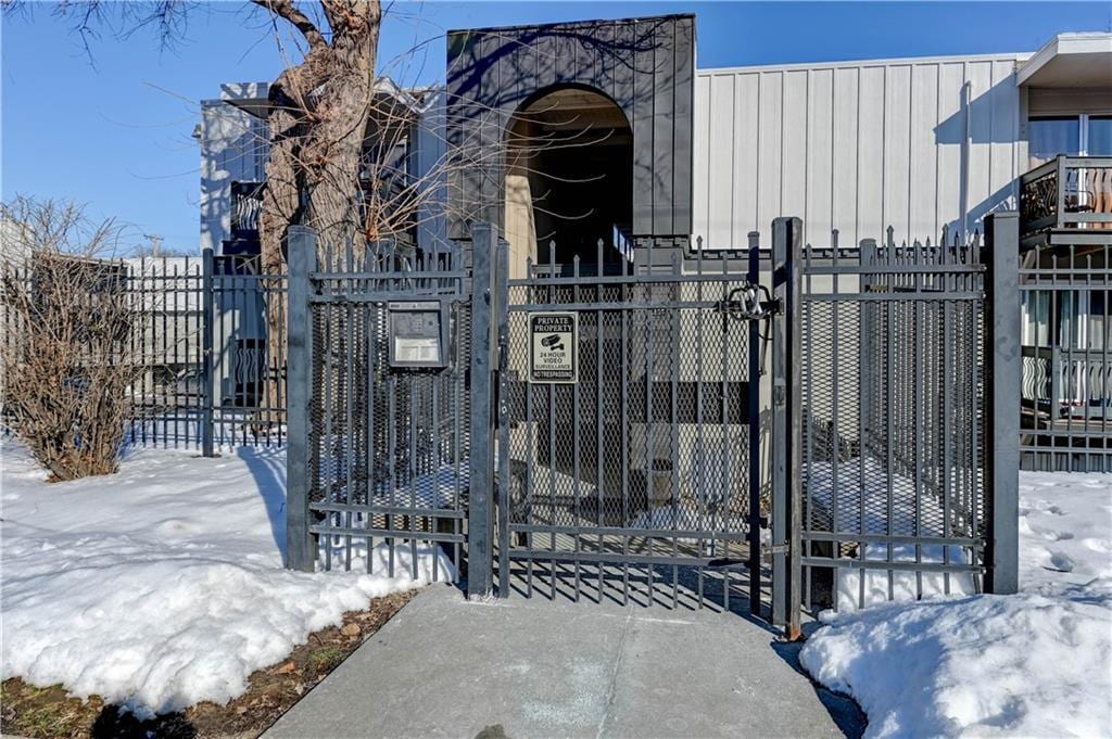 view of snow covered gate