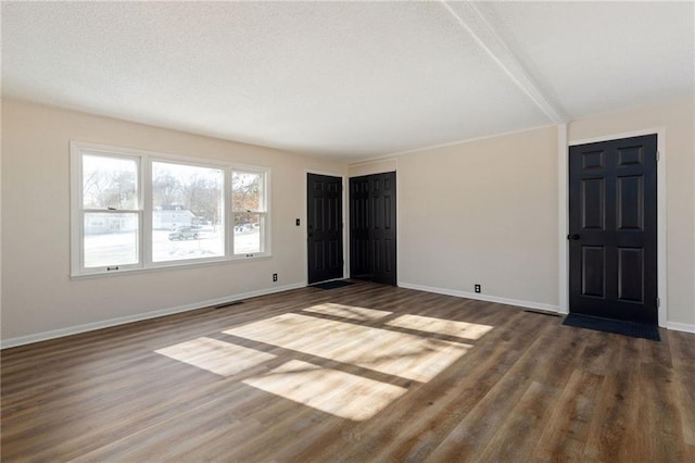 unfurnished room with dark hardwood / wood-style floors