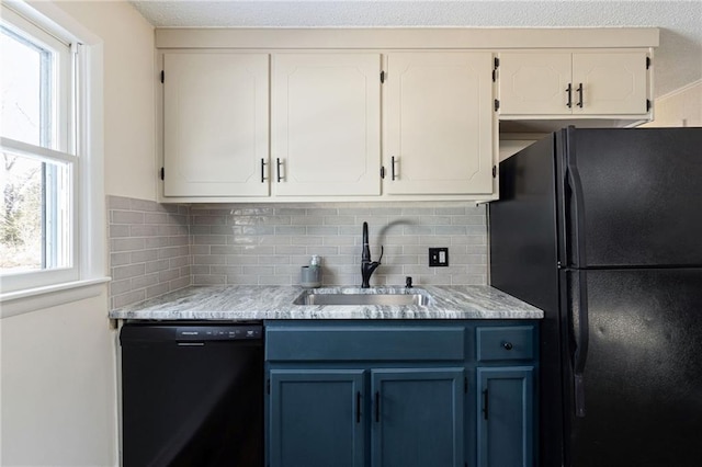 kitchen with blue cabinets, sink, decorative backsplash, and black appliances