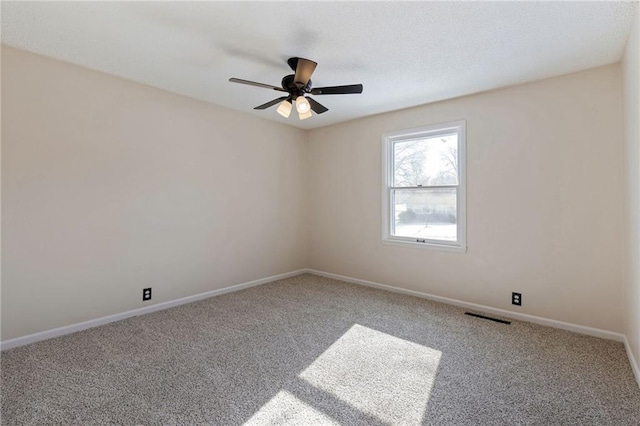 empty room with carpet floors and ceiling fan